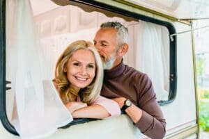 Shopping for a Pre-Owned RV(/shopping-for-a-pre-owned-rv-2/) – Portrait of an attractive grey haired man kissing 2023 11 27 05 35 29 utc